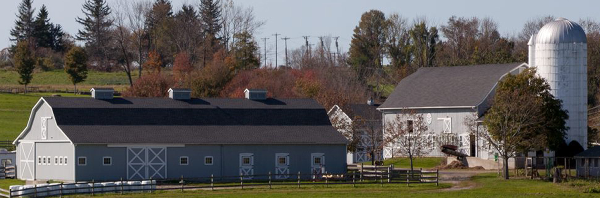 banner image of a farm house and barn